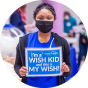 Build-A-Bear girl with Make A Wish sign